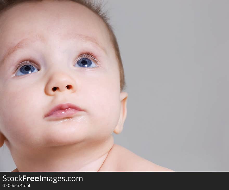 Curious baby boy looking up