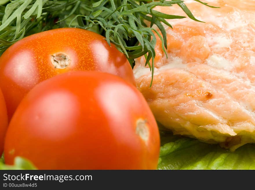 Stake from a salmon with vegetables on a plate