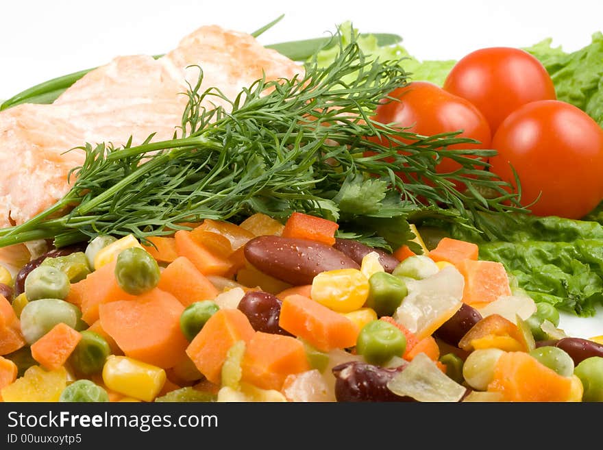 Stake from a salmon with vegetables on a plate