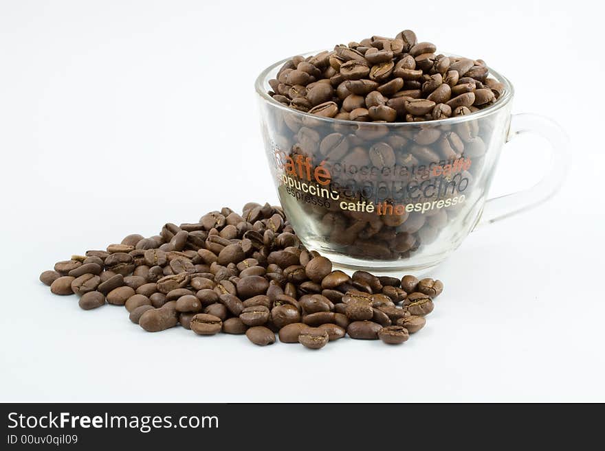 Coffee beans in a cup isolated on a white background