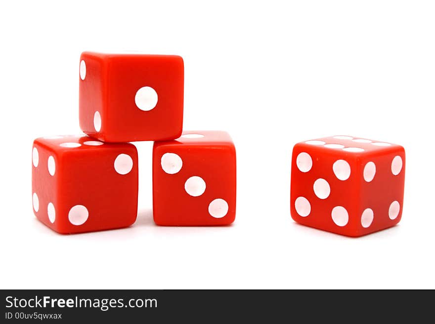 Four red dice over a white surface