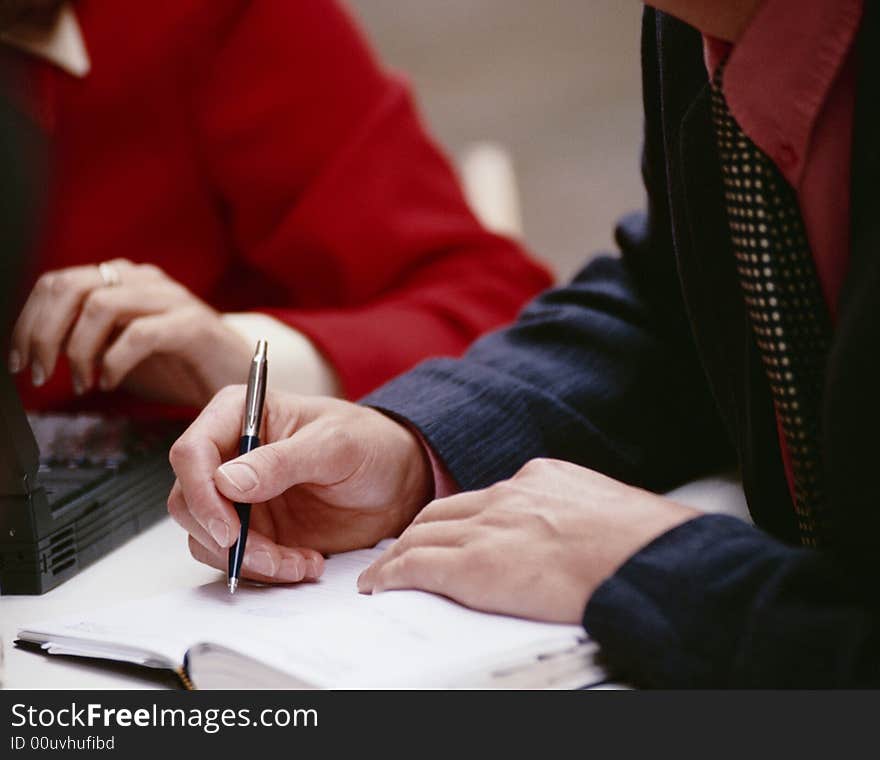 Hand keeps ball-point pen and writes in commonplace-book. Hand keeps ball-point pen and writes in commonplace-book