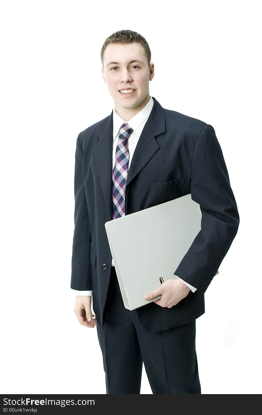 A young businessman holding a file in the studio. A young businessman holding a file in the studio