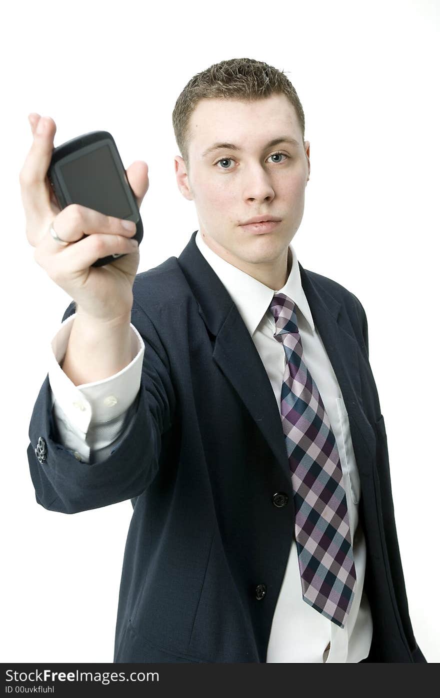 A young handsome businessman using a PDA device in the studio