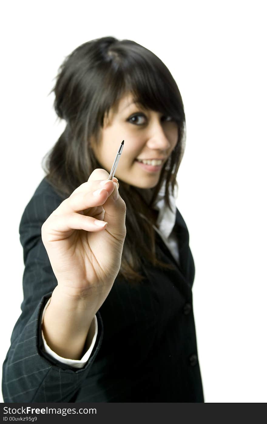 A young pretty businesswoman writing towards the camera with a stylus pen. A young pretty businesswoman writing towards the camera with a stylus pen