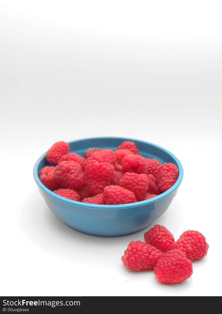 Few raspberries in bowl