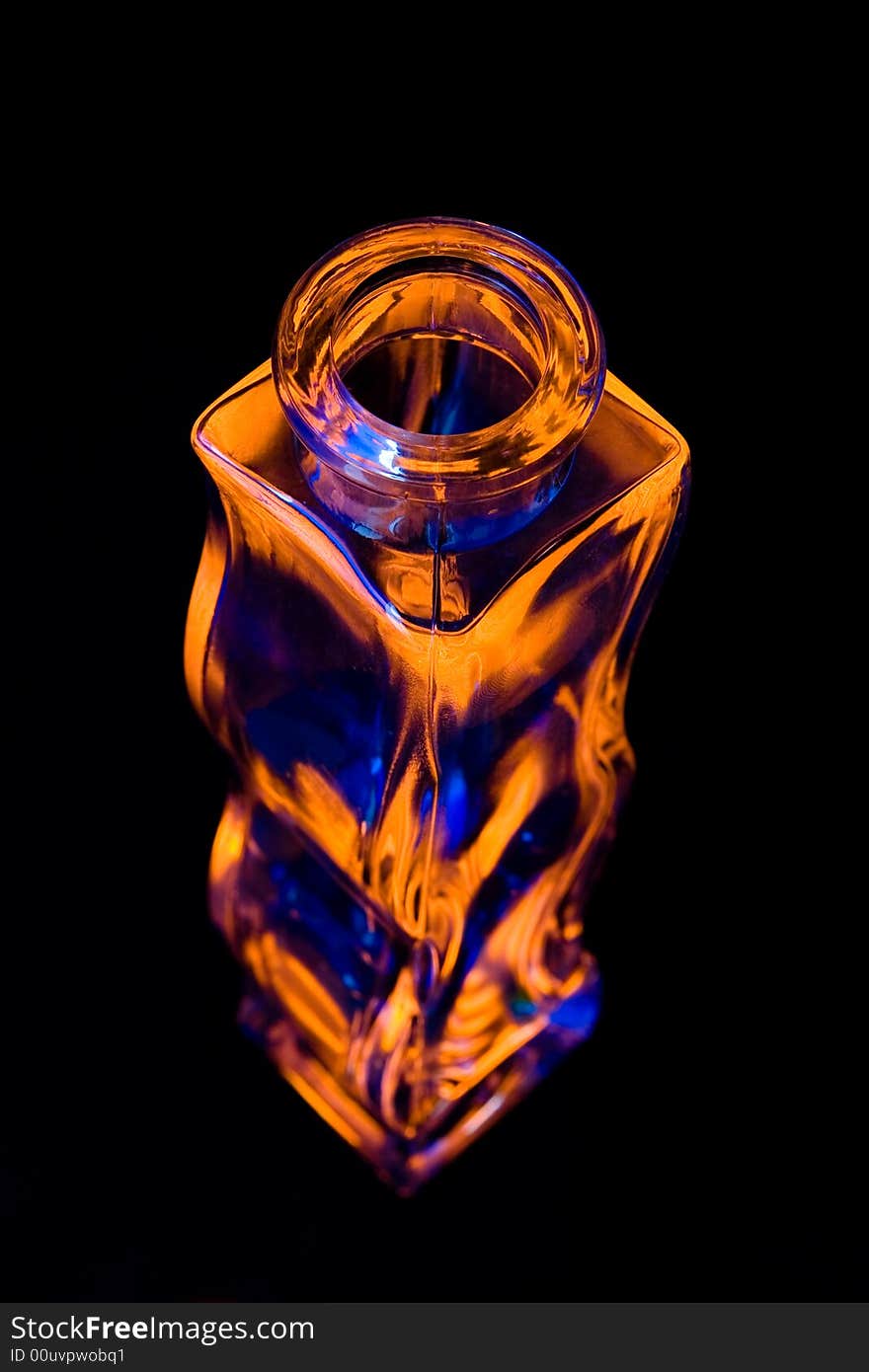 Orange and blue vase on black background. Orange and blue vase on black background