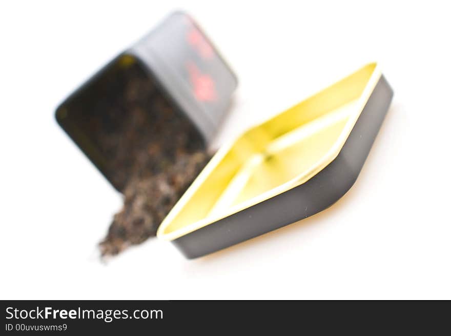 Tea-box with  tea leaves, isolated on a white background. Tea-box with  tea leaves, isolated on a white background