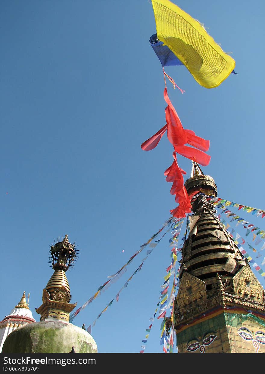 Nepalese stupa -Monkey Tample with colorful prayer flags and clear blue sky