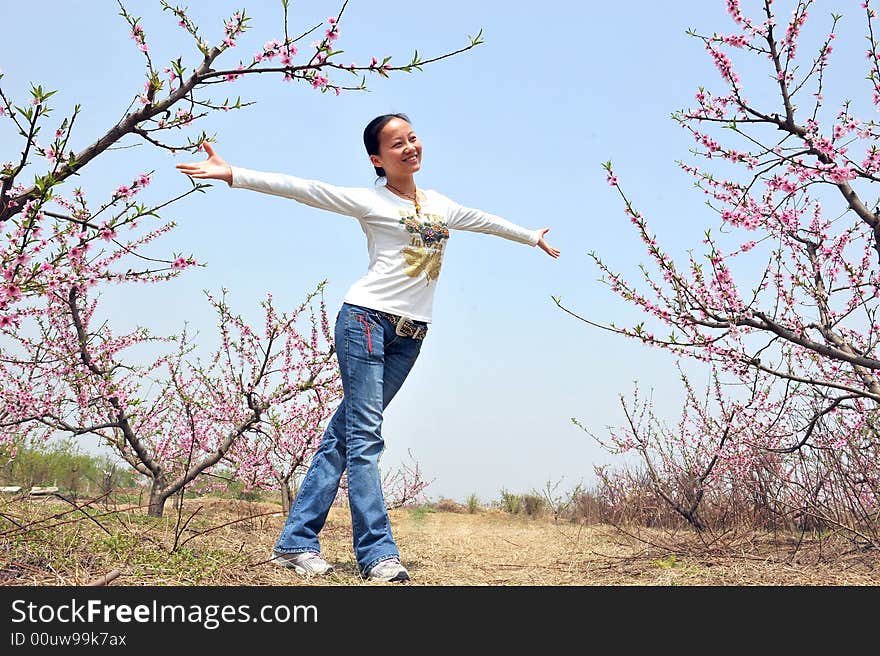 Girl In Peach Tree Garden