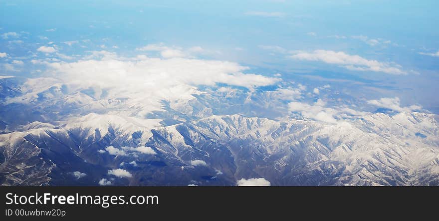 Beautiful snow mountain under clouds