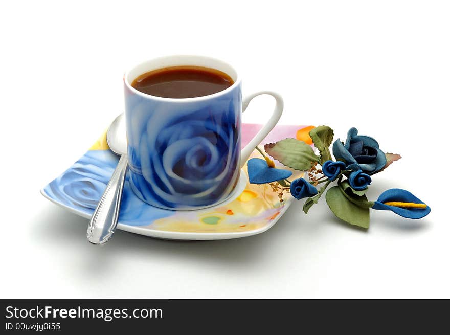 Blue cup of coffee with decoration isolated over white background