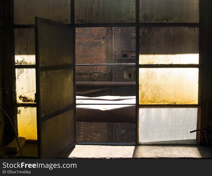 Big open window in old power factory in poland.