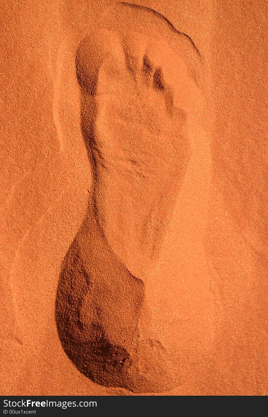 Footprint in a red sand