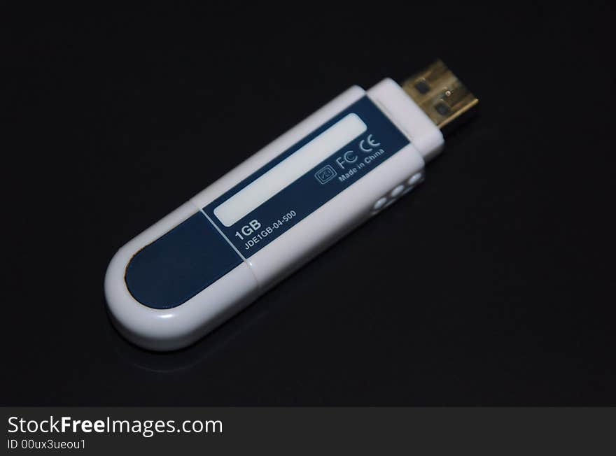 USB fash memory device on dark background. USB fash memory device on dark background