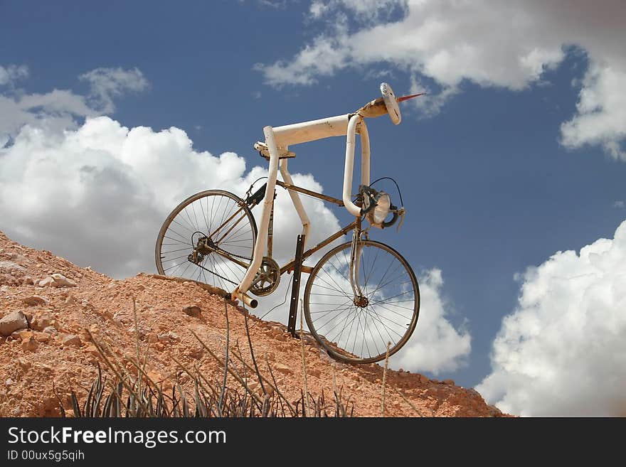 Funny sculpture of a downhill cycler. Australia.Coober pedy, South Australia