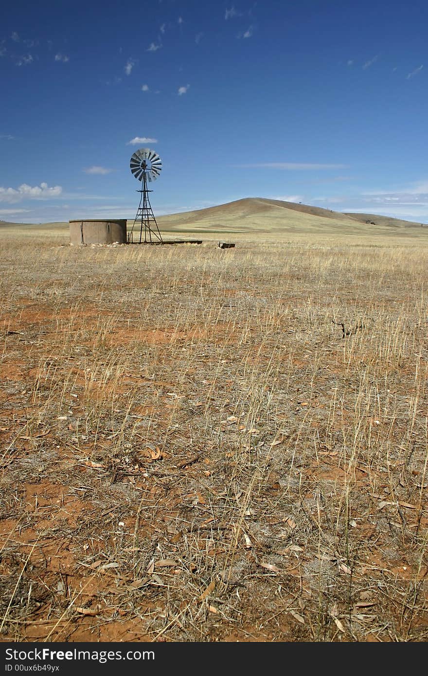 Windmill standing still in the middle of a cultivated field. South Australia