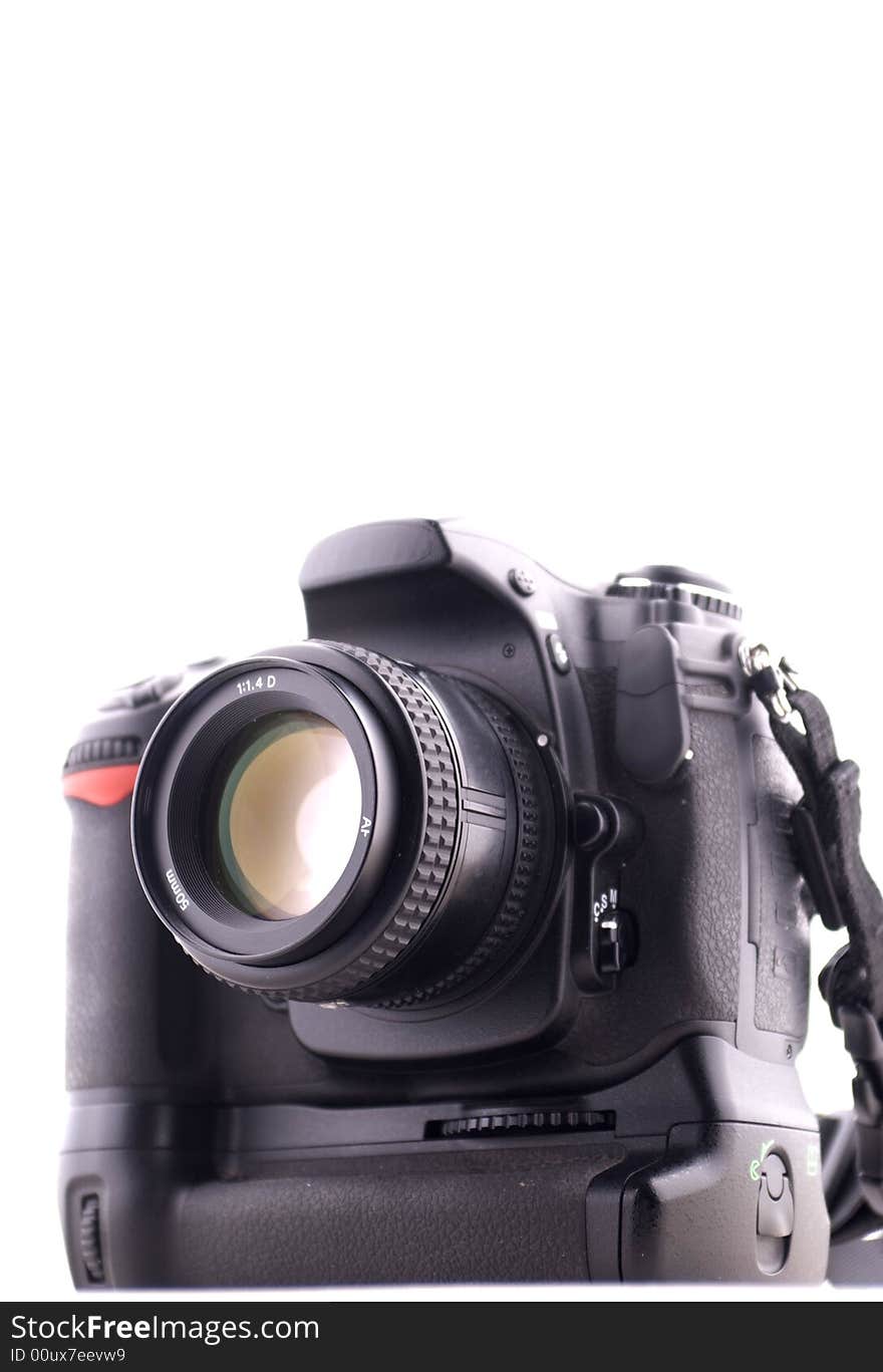 A professional digital camera with battery grip on white background.