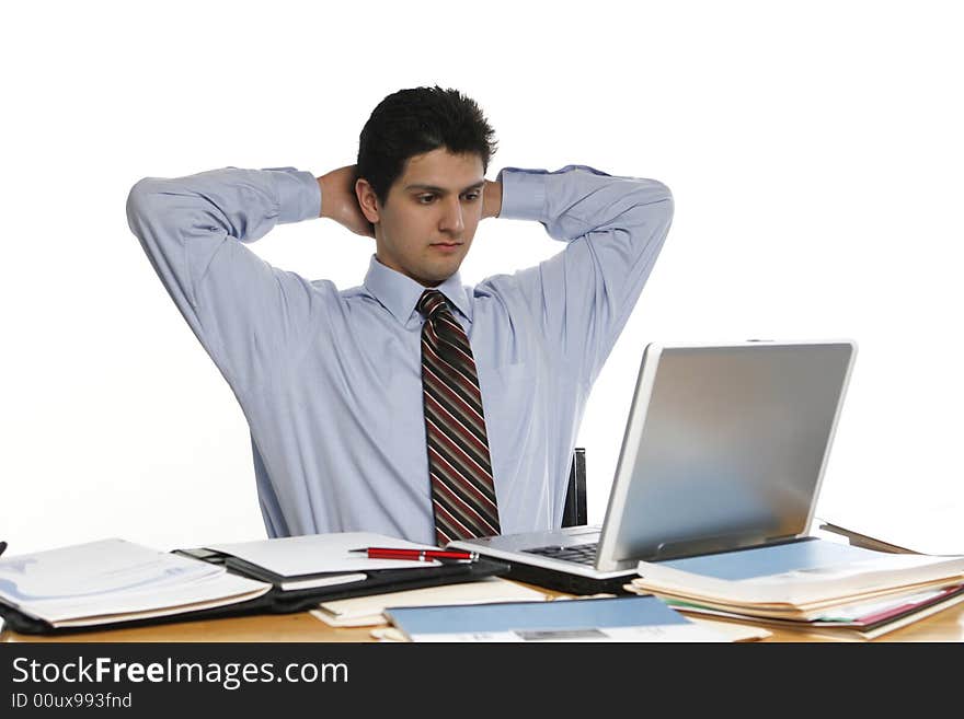 Business man leaning back with his arms up and hands behind his head. Business man leaning back with his arms up and hands behind his head