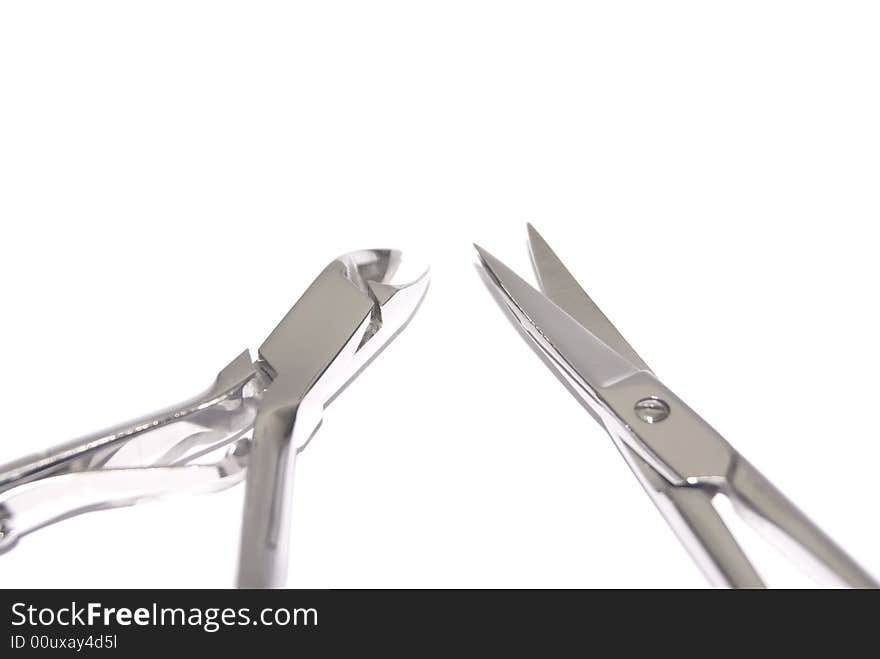 Manicure tools Cutter and scissors Closeup on white background. Manicure tools Cutter and scissors Closeup on white background