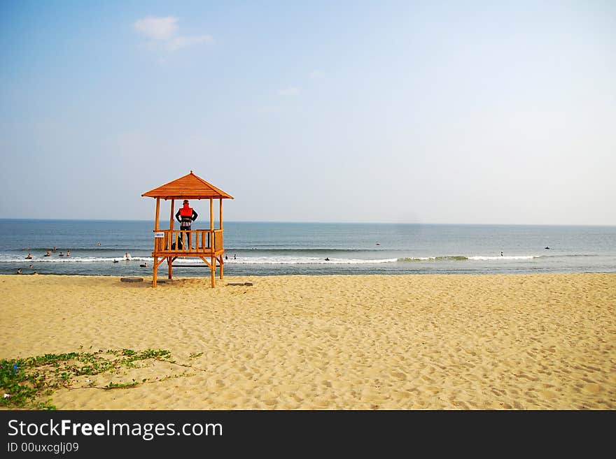 A cottage in the beach and a lifeguard in it. A cottage in the beach and a lifeguard in it.