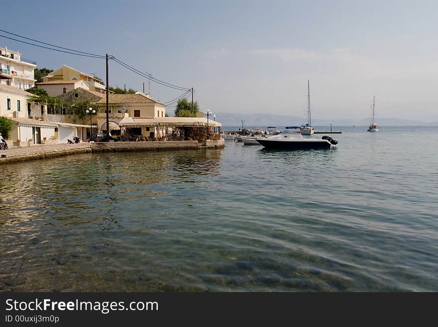 Modern boats ashore in a small Corfu village (Kassiopi)