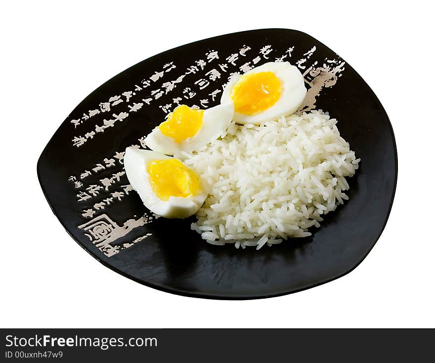 Rice and eggs on the isolated plate with hieroglyphes. Rice and eggs on the isolated plate with hieroglyphes