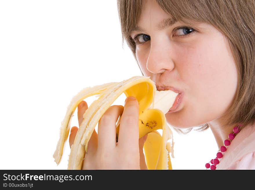 The young attractive girl with a banana isolated on a white background