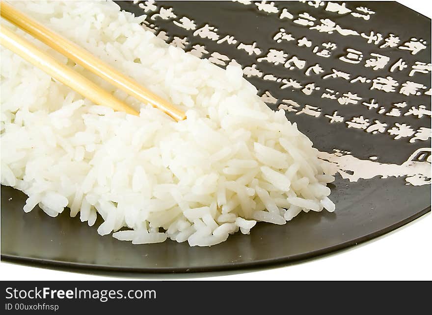 Isolated rice on the plate with hieroglyphes. Isolated rice on the plate with hieroglyphes