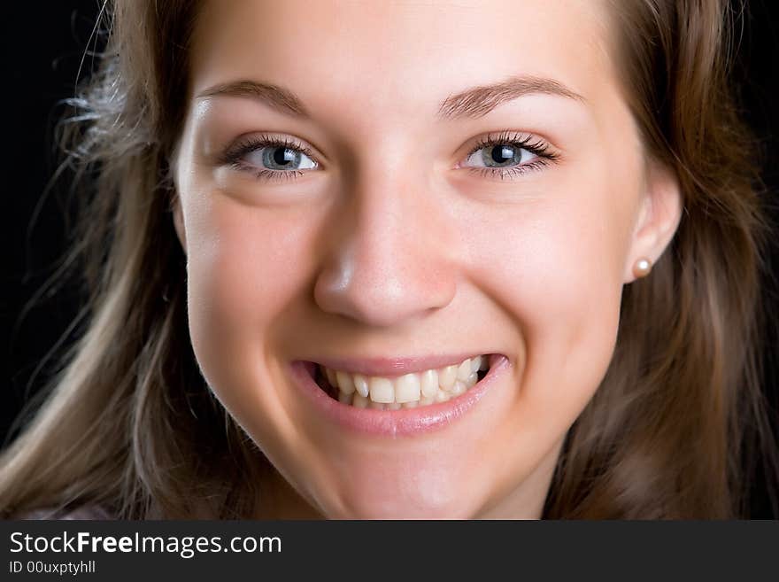 Portrait of the beautiful girl isolated on a black background