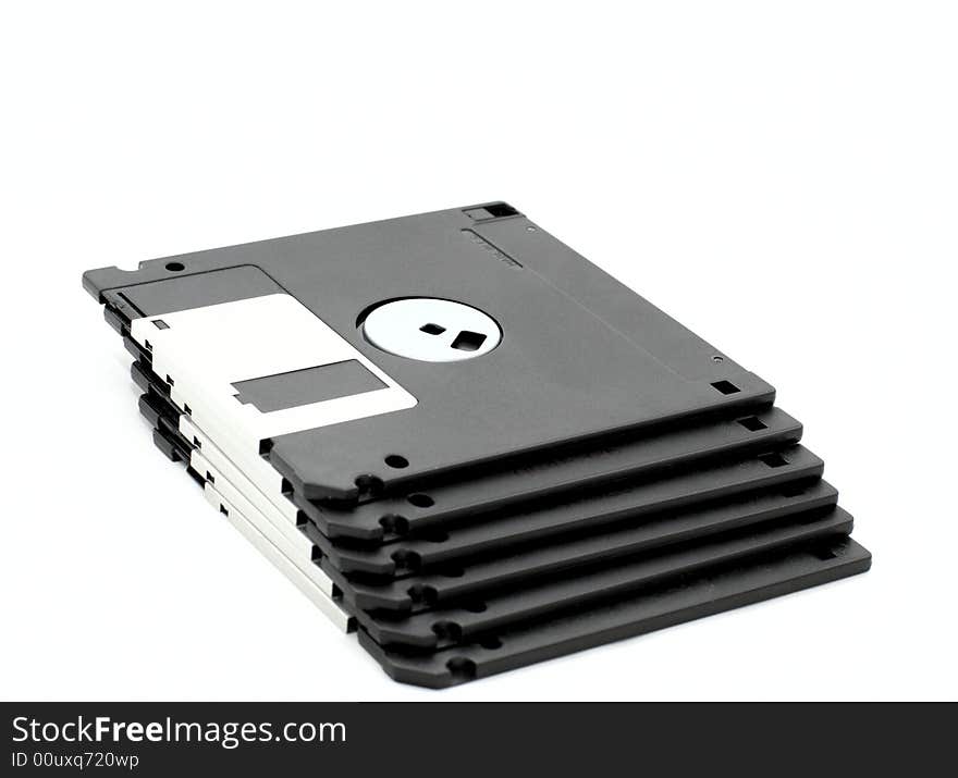 Stacked floppy disks on a white background. Stacked floppy disks on a white background