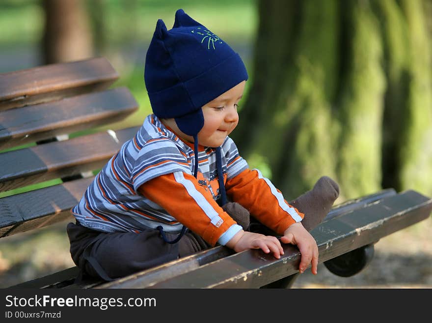 Baby sitting on the bench