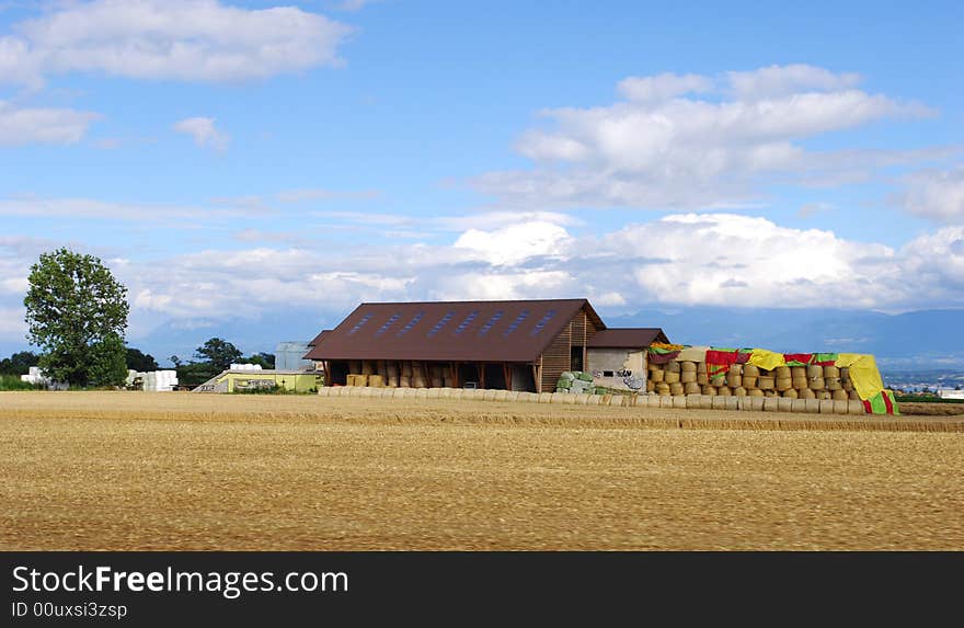 The farm house in the harvested fields, Taken in switzerland.