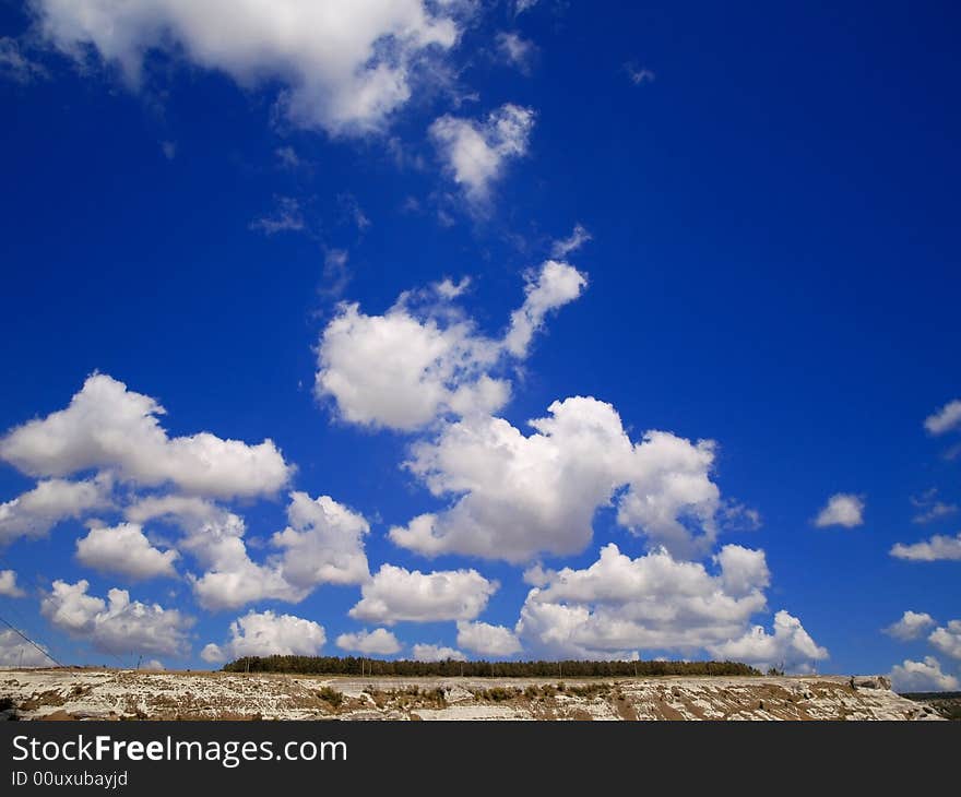 White clouds blue  sky sun