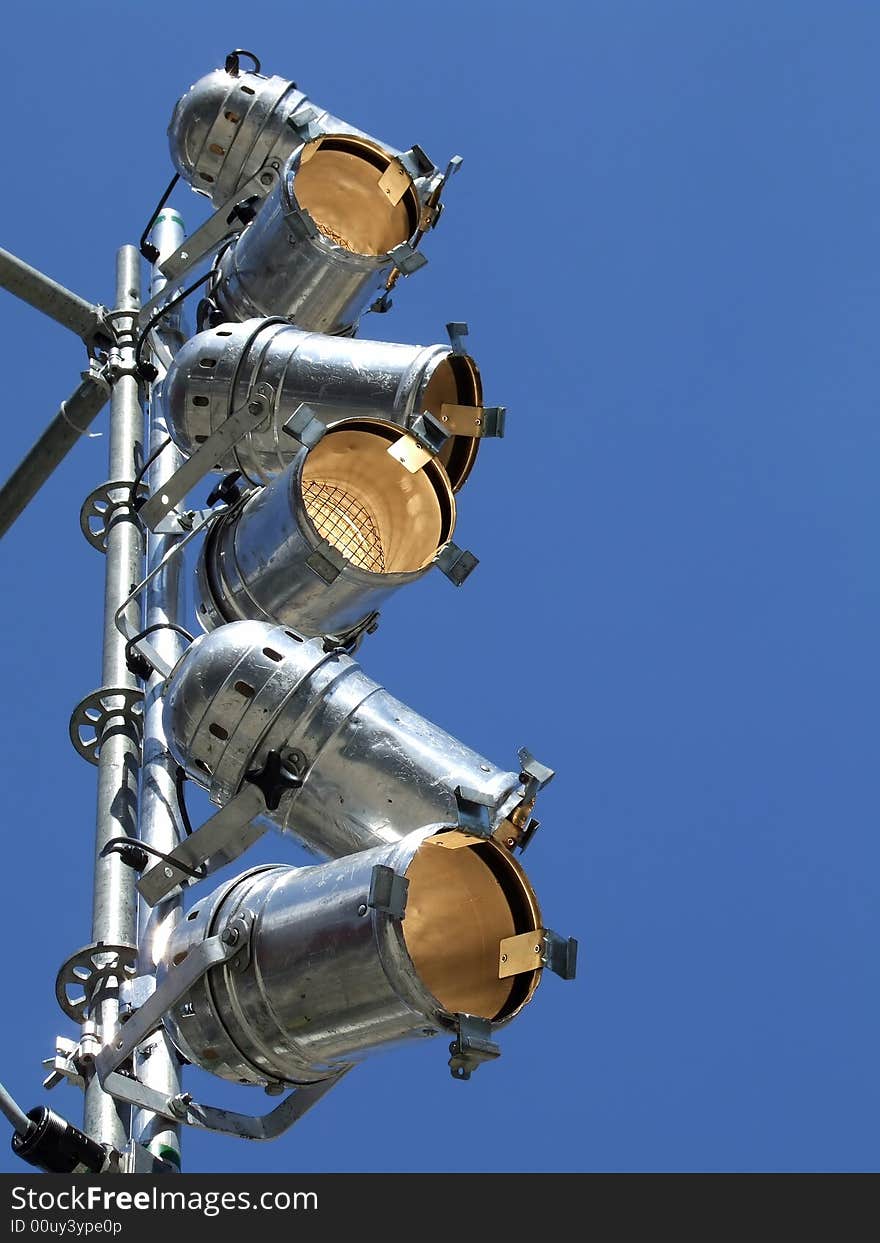 Spotlights on the background of the blue sky. Spotlights on the background of the blue sky