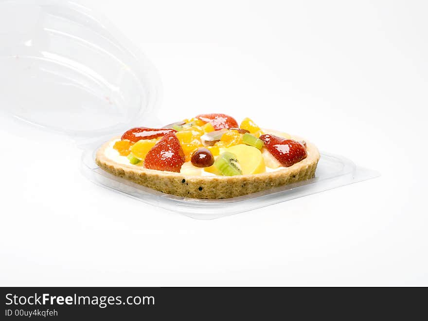 A fruit pie in a plastic transparent box