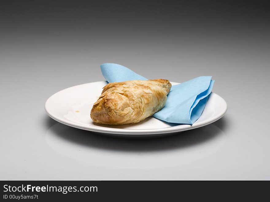 Croissants on a plate with a blue tissue