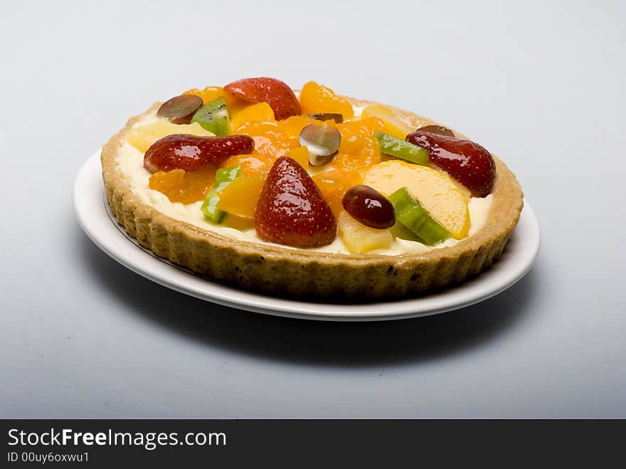 A fruit pie on a white plate