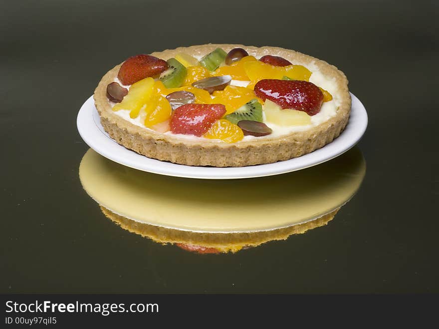 A fruit pie on a white plate