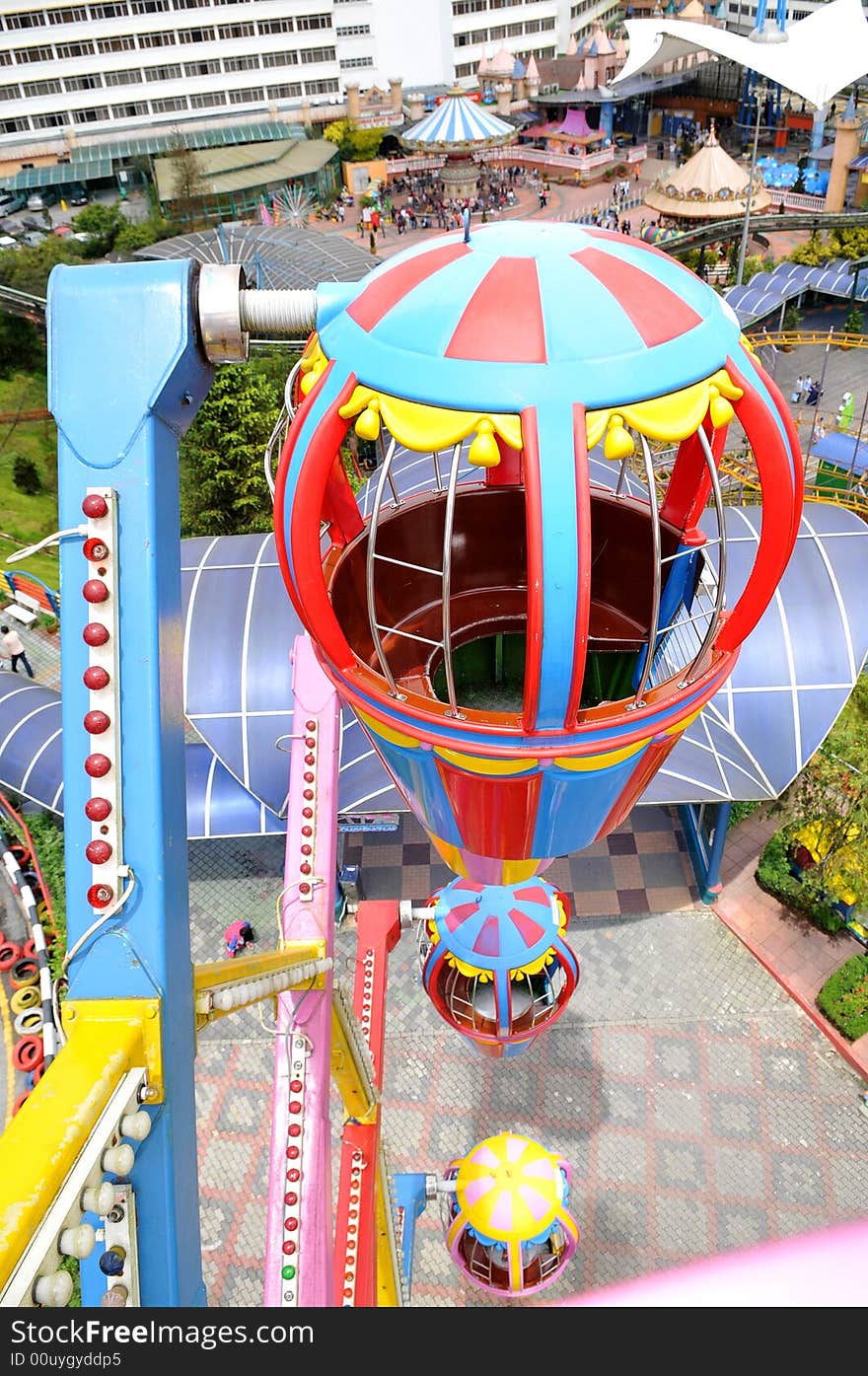 A shot of a ferris wheel from high level looking downwards