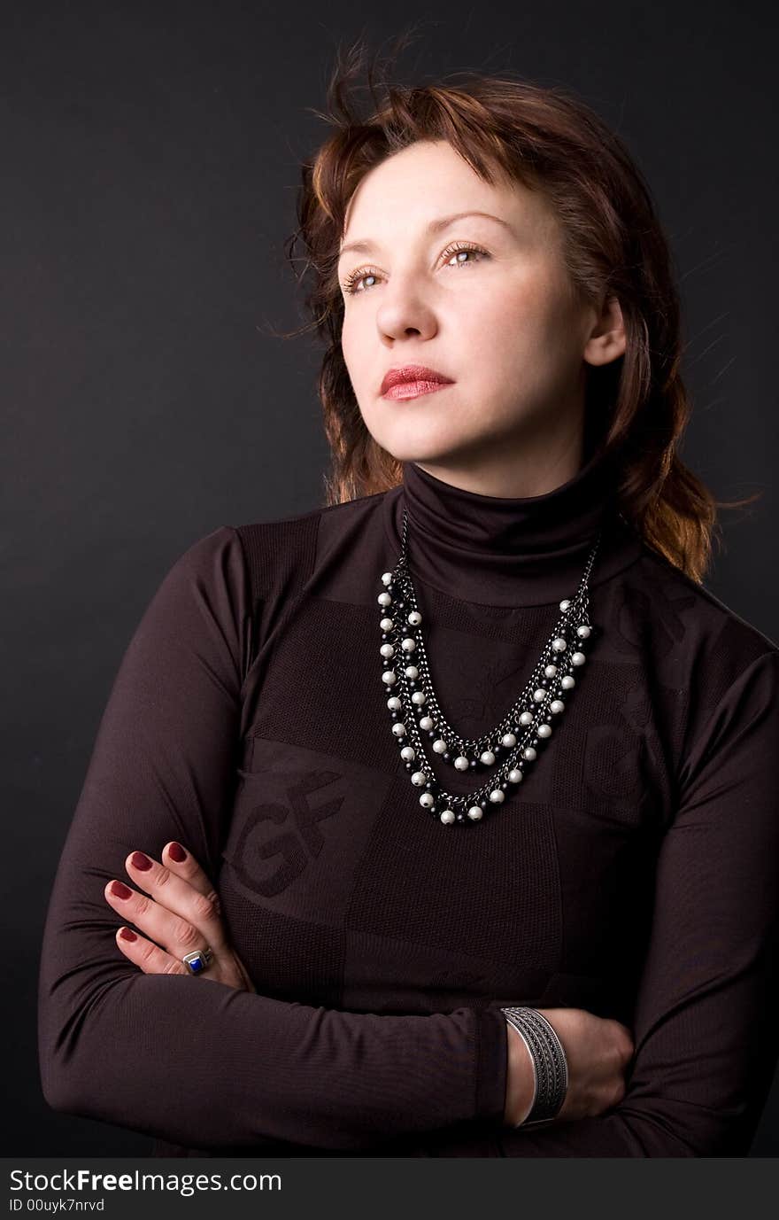 Portrait of the woman in studio on a black background. Portrait of the woman in studio on a black background.