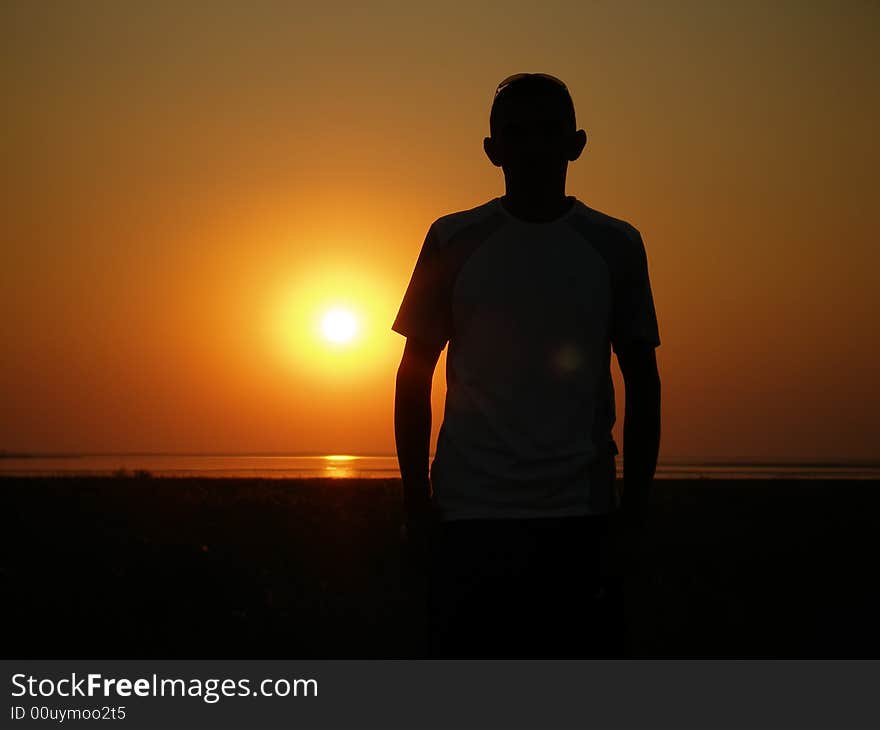 Silhouette Of The Man On A Sunset