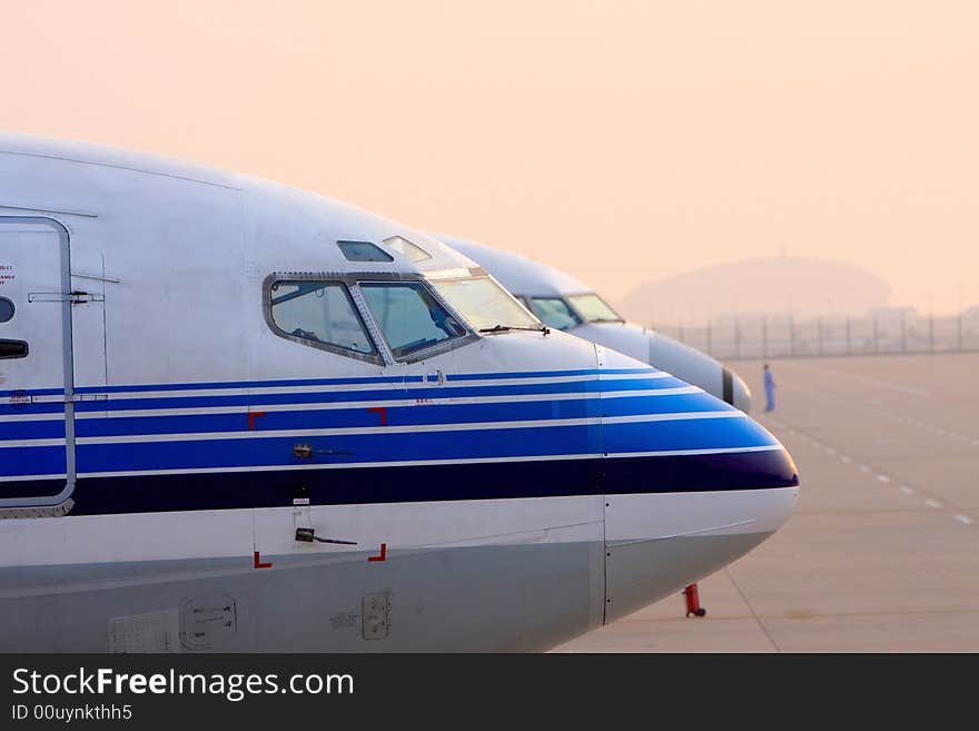 Aircrafts standby for flight, every morning these metal birds fly to somewhere far away. Aircrafts standby for flight, every morning these metal birds fly to somewhere far away.