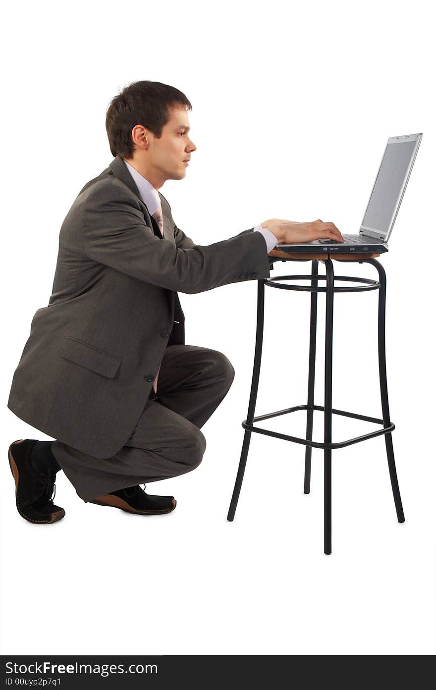 Young businessman works with laptop. Young businessman works with laptop