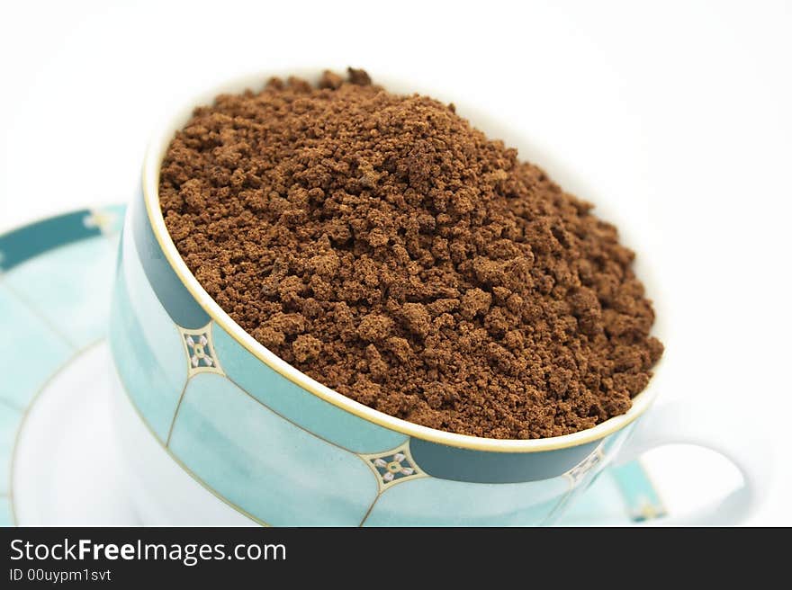 Coffee inside a cup on white background.