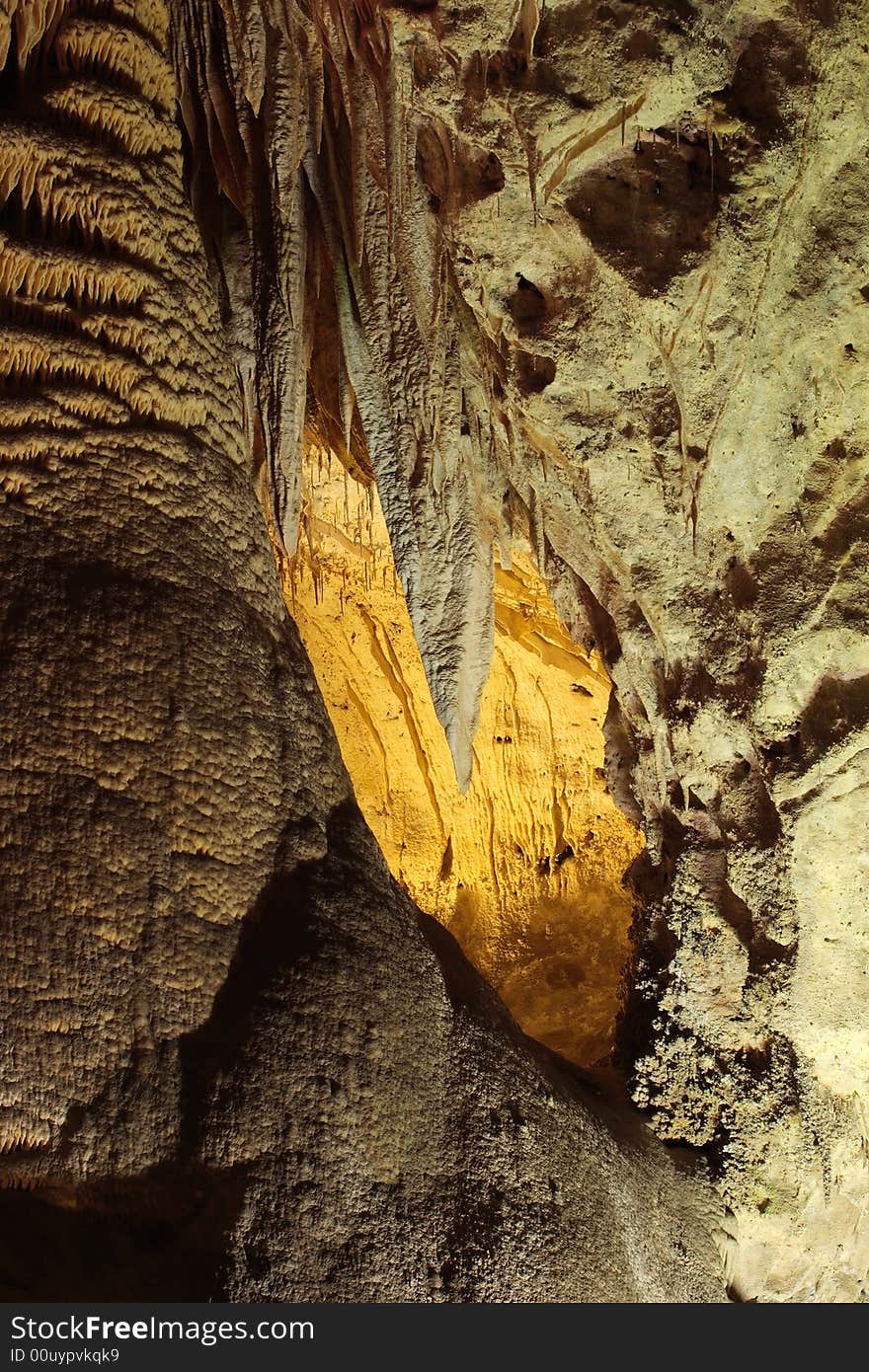 Yellow lit cave in the Big Room of Carlsbad Caverns National Park. Yellow lit cave in the Big Room of Carlsbad Caverns National Park