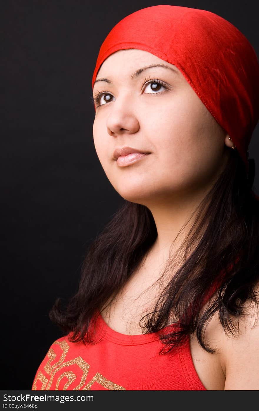 Multi-ethnic girl in studio on black background. Multi-ethnic girl in studio on black background.