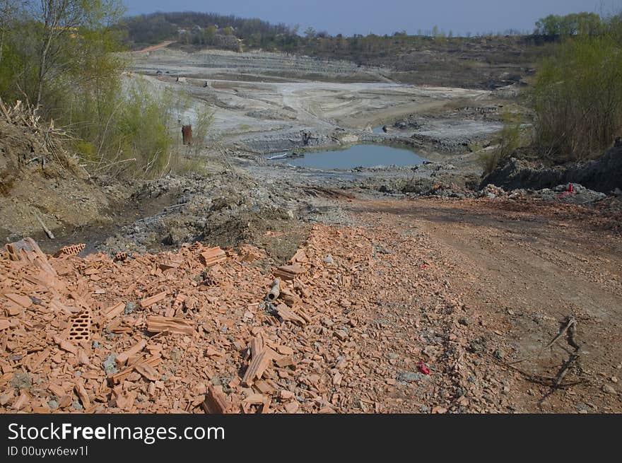 Huge opencast mine for digging the gault with the lake in the middle