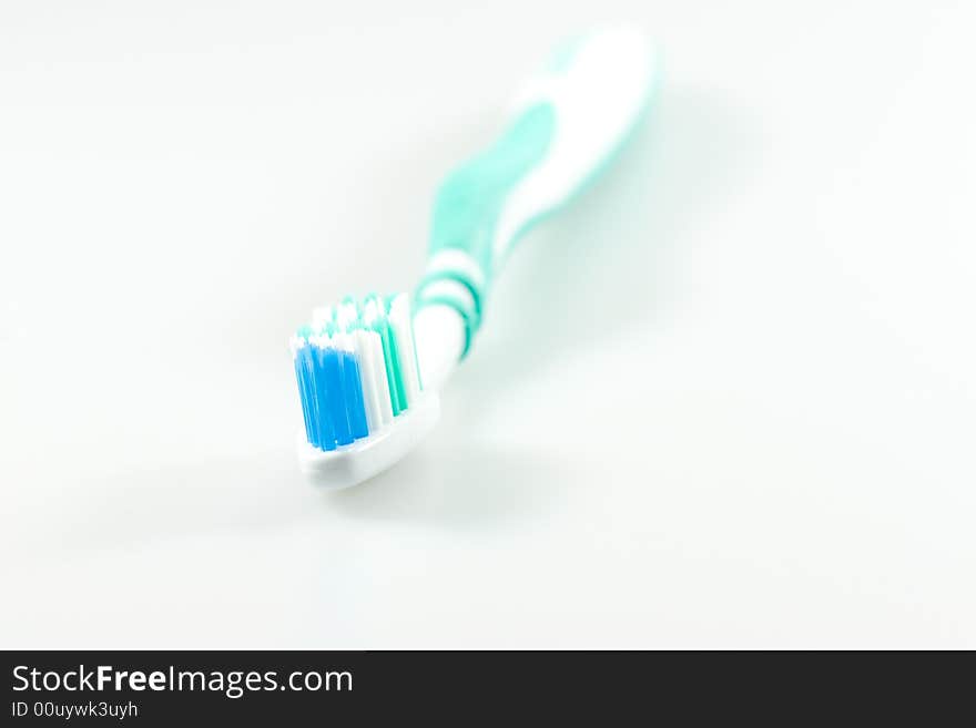 Green and white tooth brush. Green and white tooth brush