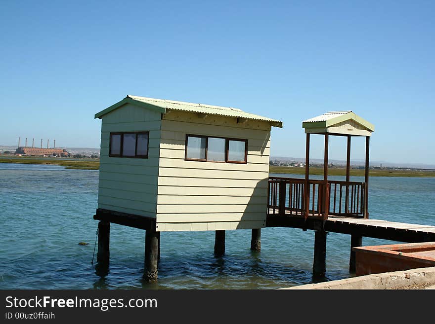 A house up on stilts on the river. A house up on stilts on the river